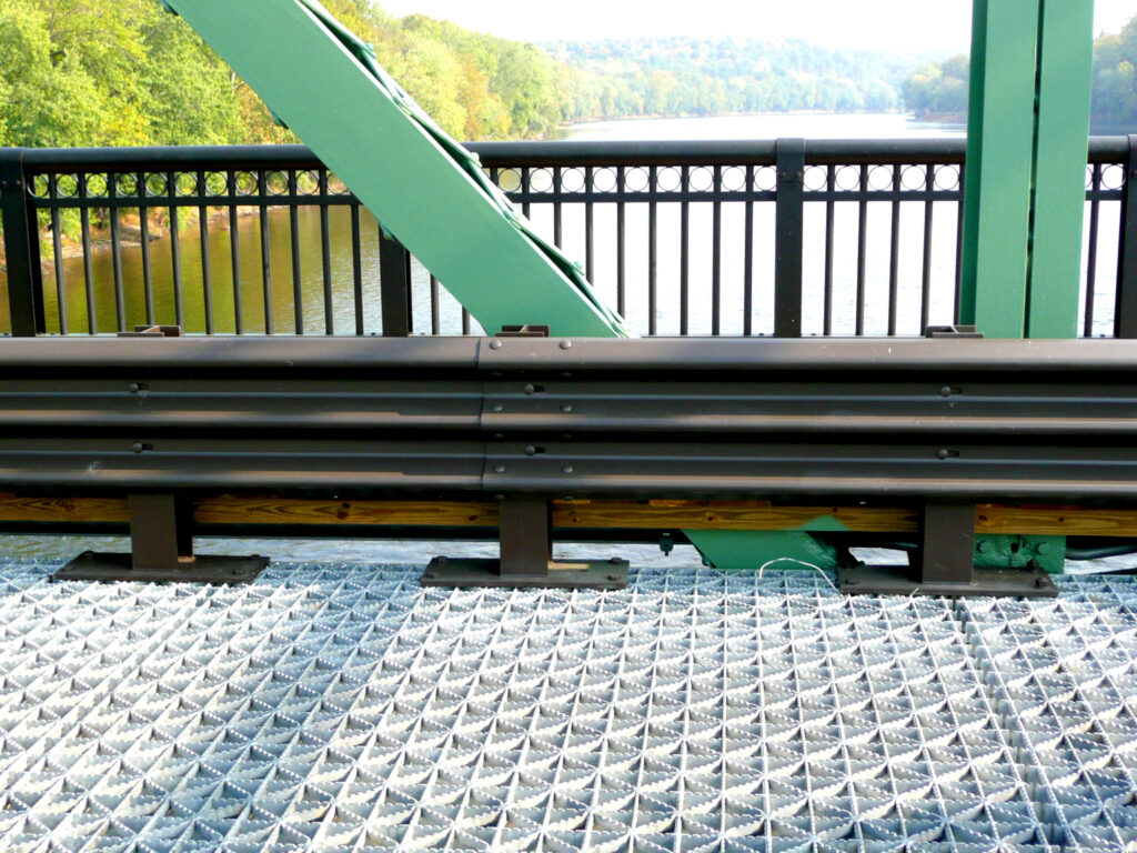 close up of bridge guard rail powder coating